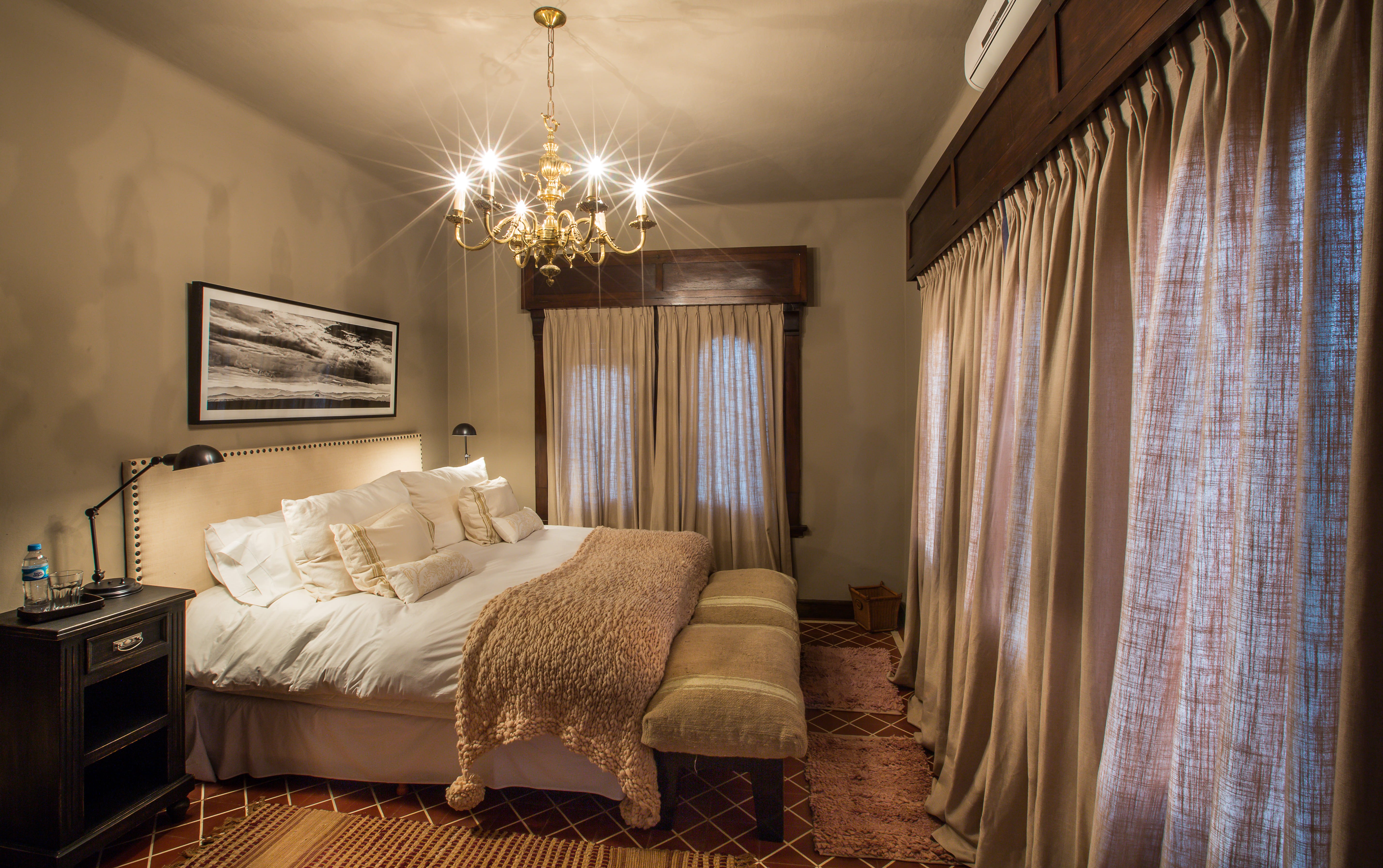 Luxurious master bedroom with chandelier